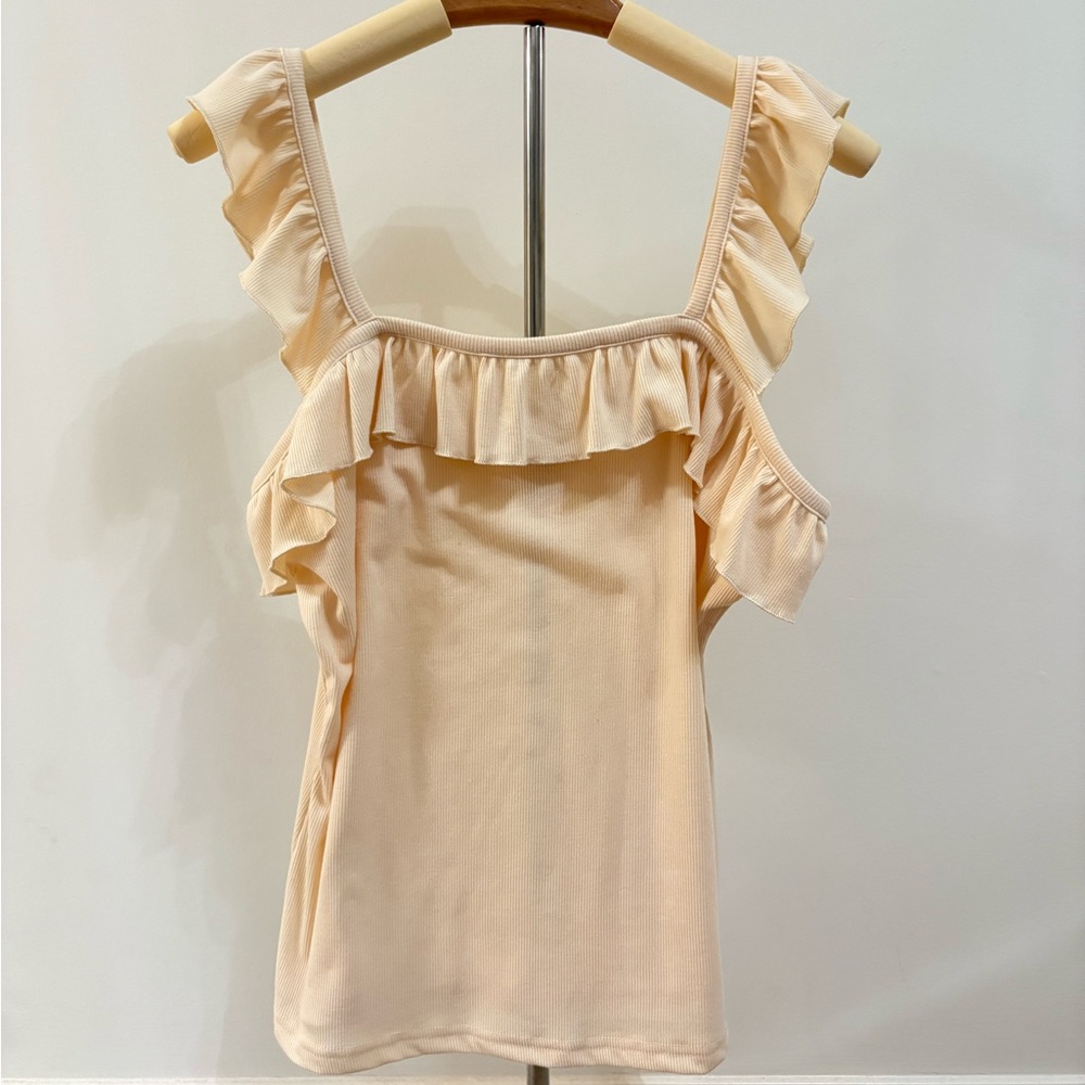 ruffled cream top